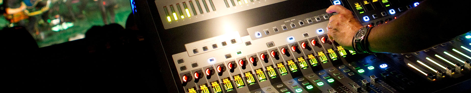 image of students using a mixer desk