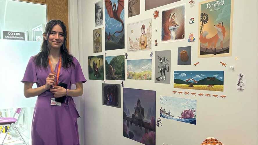 Student/s standing alongside the assets from their enterprise project