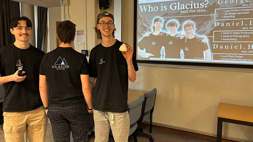 Student/s standing alongside the assets from their enterprise project